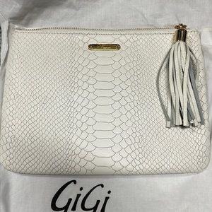 White embossed python clutch.
